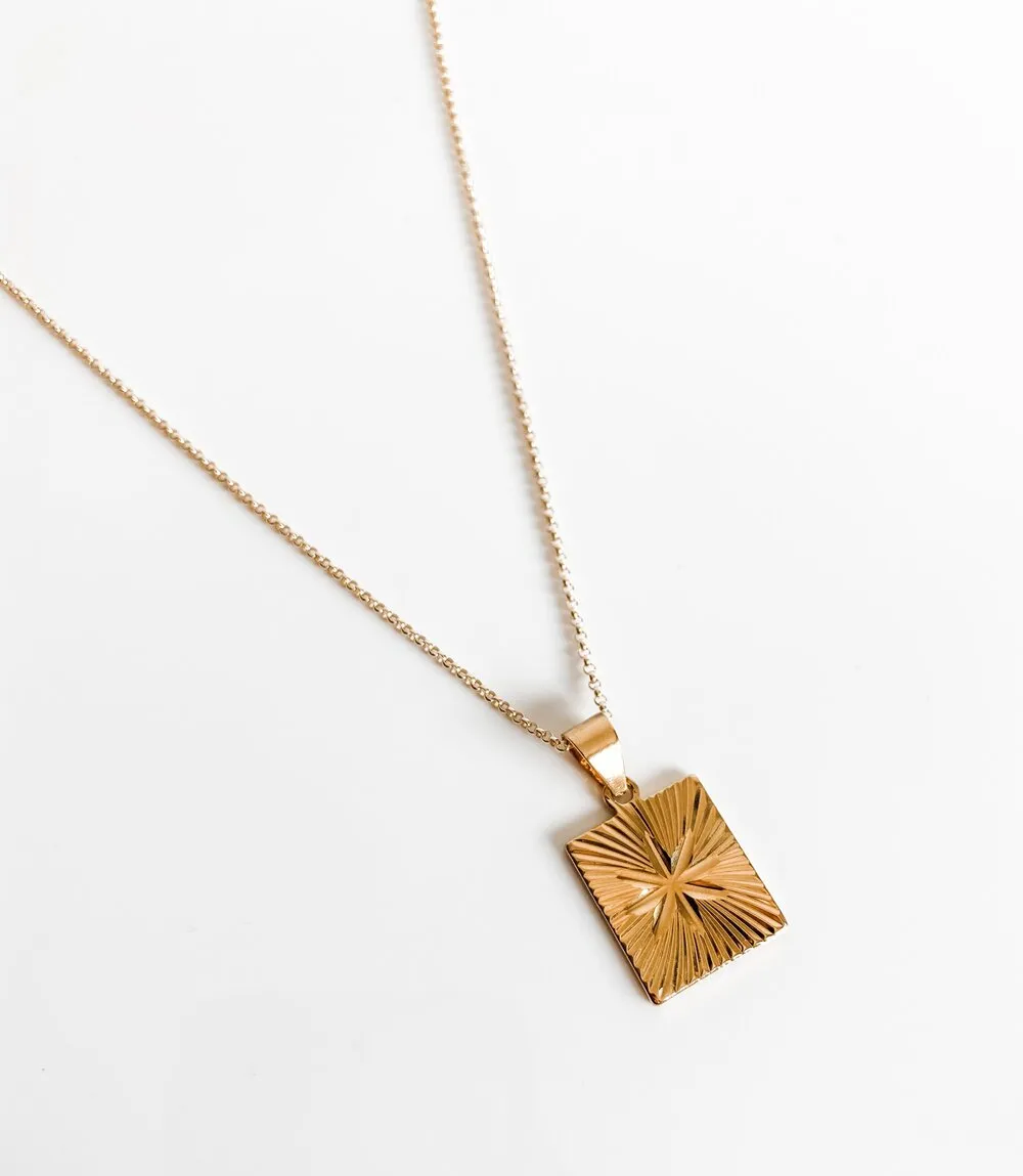 THE RUBY STARBURST PENDANT