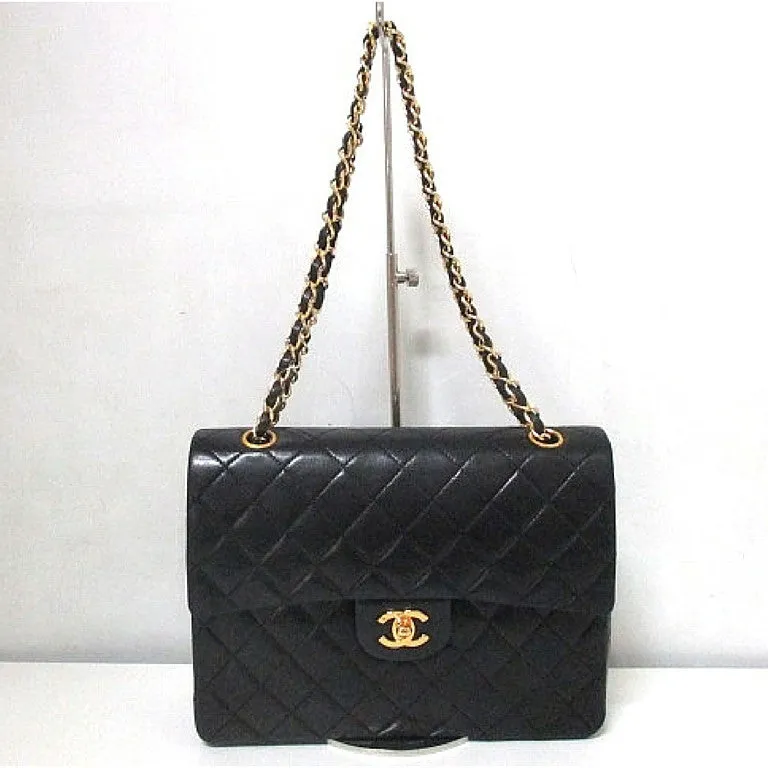 Vintage CHANEL black lambskin classic 2.55 double flap shoulder purse with golden chain straps. Make you even more chic. 061107k1ys